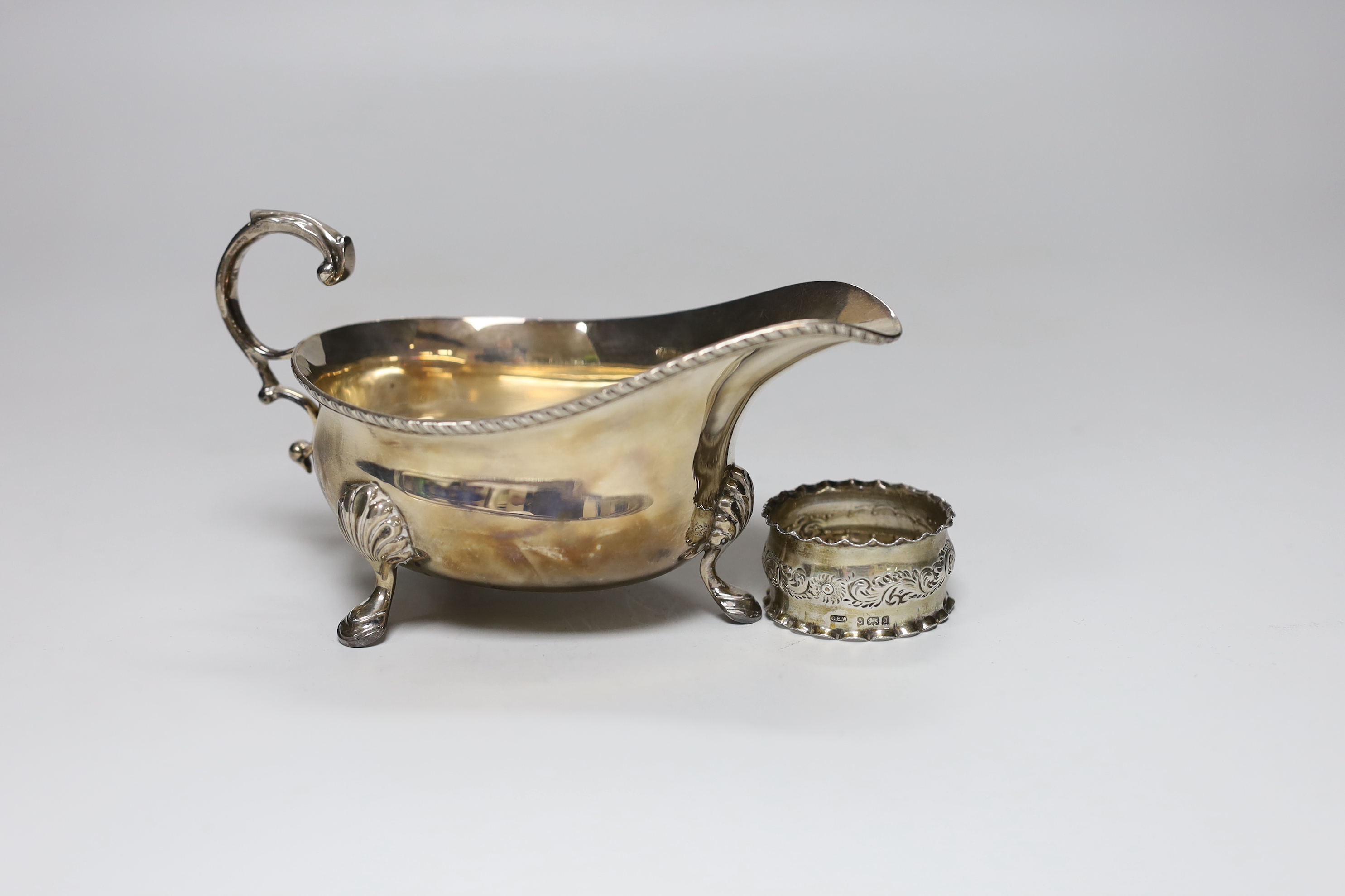 A 1930's silver sauceboat and a napkin ring, 5.6oz.